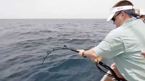 Chris Cleaver with his recently caught and released hybrid cod he likes to call a Murrout (cross between a Murray and trout cod).